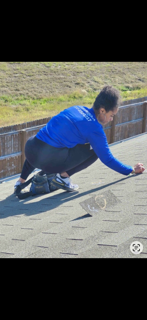 Contractor inspecting a roof before preparing a project scope